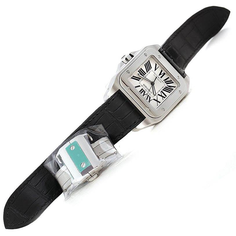 The image shows a Cartier Santos W20073X8 Men
s Stainless Steel Silver Dial W20073X8 Men
s Stainless Steel Silver Dial watch from a top-down angle, featuring a black leather strap and the square dial.