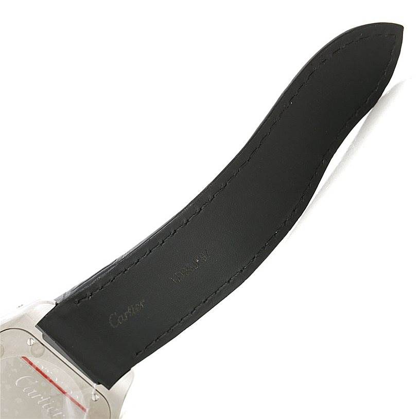 The image shows a close-up view of the black leather strap and part of the case back of a Cartier Santos W20073X8 Men
s Stainless Steel Silver Dial W20073X8 Men
s Stainless Steel Silver Dial watch.