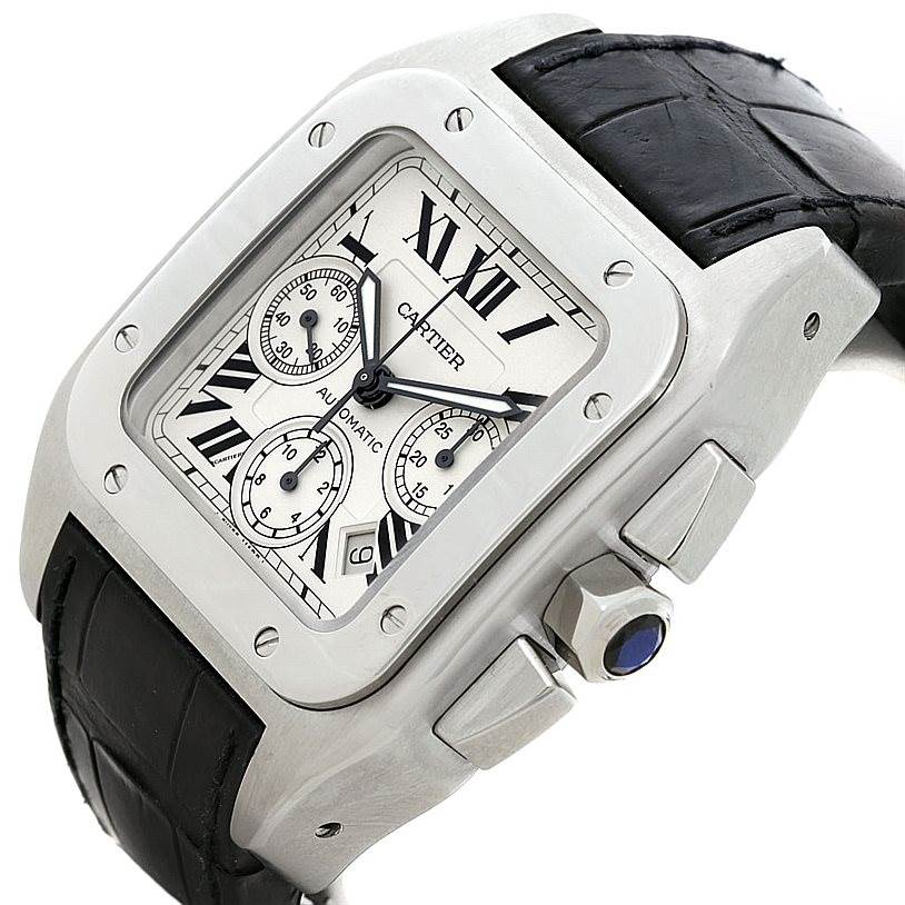 The image shows a close-up of a Cartier Santos W20090X8 Men
s Stainless Steel Silver Dial W20090X8 Men
s Stainless Steel Silver Dial watch, displaying the dial, bezel, crown, case, and part of the black leather strap.
