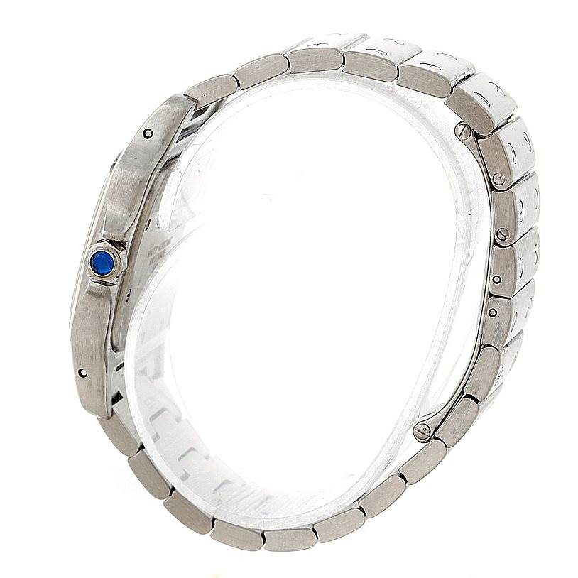 The image shows a side angle of a Cartier Santos W20060D6 Men's Stainless Steel Silver Dial W20060D6 Men's Stainless Steel Silver Dial watch, highlighting its metal bracelet and crown with a blue stone.