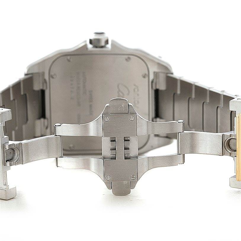 The image shows the backside and deployment clasp of a Cartier Santos W200728G Men
s Stainless Steel Silver Dial W200728G Men
s Stainless Steel Silver Dial watch at an angle facing the watch
s case back.