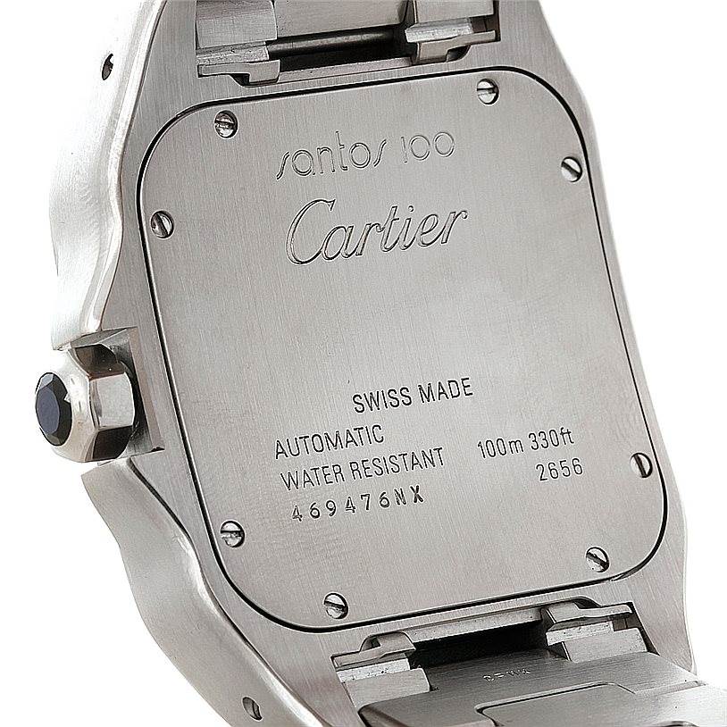 The image shows the back case of a Cartier Santos W200728G Men
s Stainless Steel Silver Dial W200728G Men
s Stainless Steel Silver Dial 100 watch, displaying inscriptions and part of the bracelet attachment.