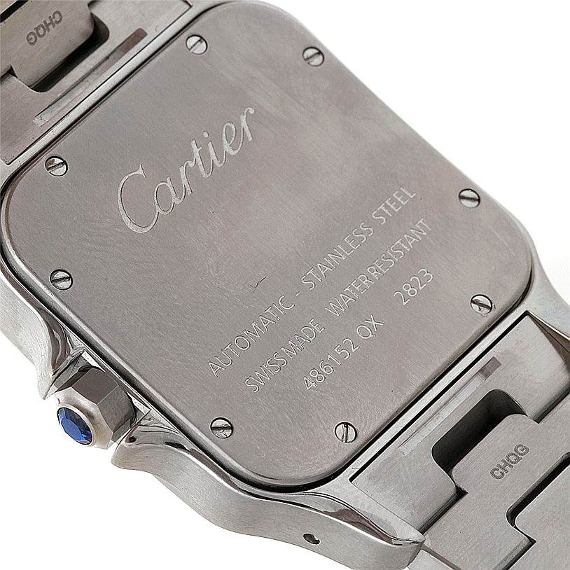 This image shows the back case and part of the bracelet of a Cartier Santos W20098D6 Men's Stainless Steel Silver Dial W20098D6 Men's Stainless Steel Silver Dial watch, highlighting the engraved details.