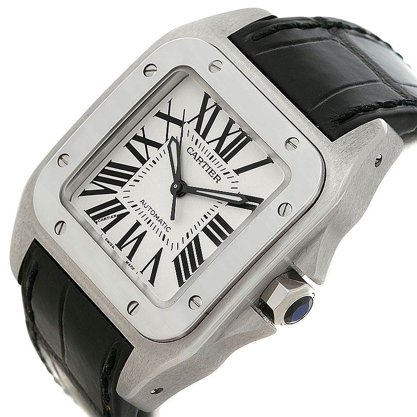 The image shows a Cartier Santos W20106X8 Men
s Stainless Steel Silver Dial W20106X8 Men
s Stainless Steel Silver Dial watch at an angled close-up view, highlighting the black leather strap, dial with Roman numerals, and crown.