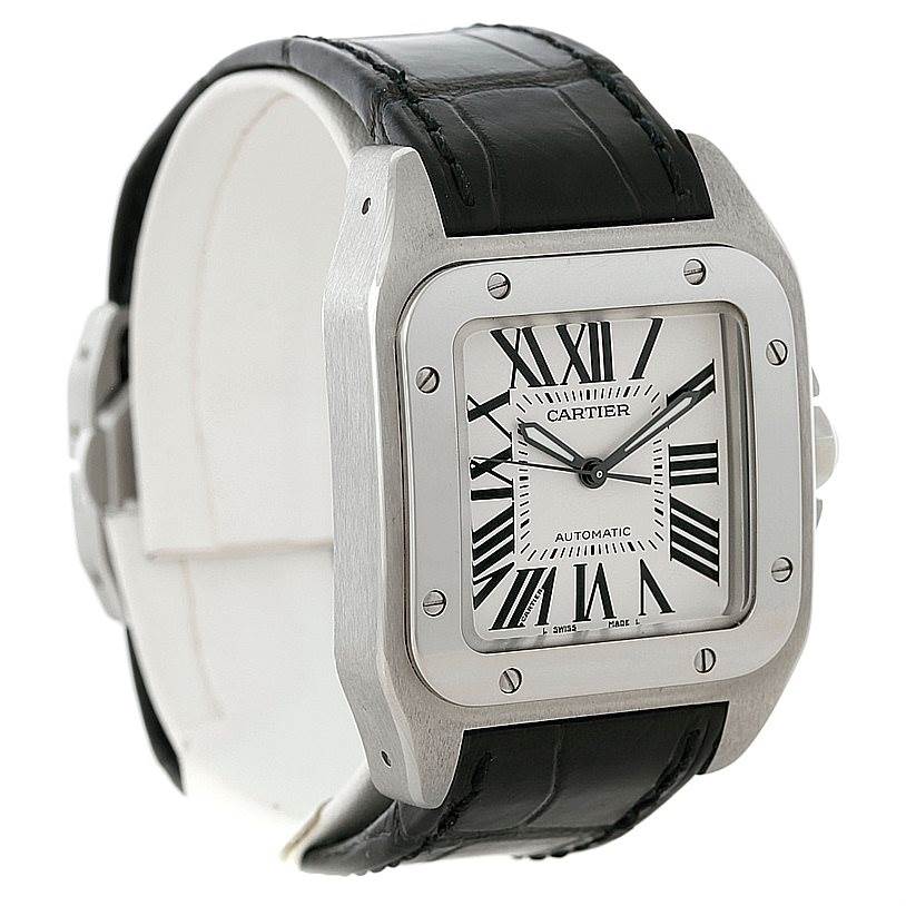 This image shows a Cartier Santos W20106X8 Men
s Stainless Steel Silver Dial W20106X8 Men
s Stainless Steel Silver Dial watch from a three-quarter view, highlighting its square face, black leather strap, and Roman numeral dial.