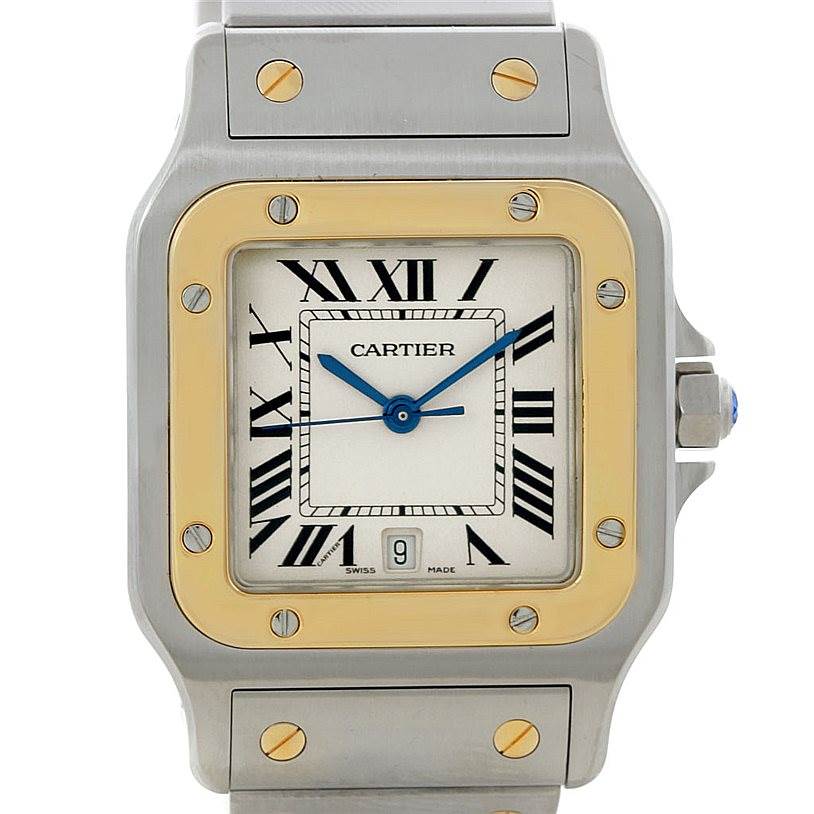 The image shows a close-up of the face of a Cartier Santos W20011C4 Men
s Stainless Steel Silver Dial W20011C4 Men
s Stainless Steel Silver Dial watch, highlighting its bezel, dial, and hands.