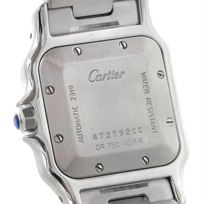 This image shows the back case and part of the bracelet of a Santos by Cartier watch.