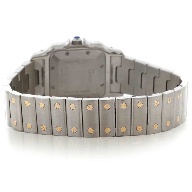 The image shows the back and bracelet of the Cartier Santos W20058C4 Men
s Stainless Steel Silver Dial W20058C4 Men
s Stainless Steel Silver Dial watch with gold screws visible on the links.