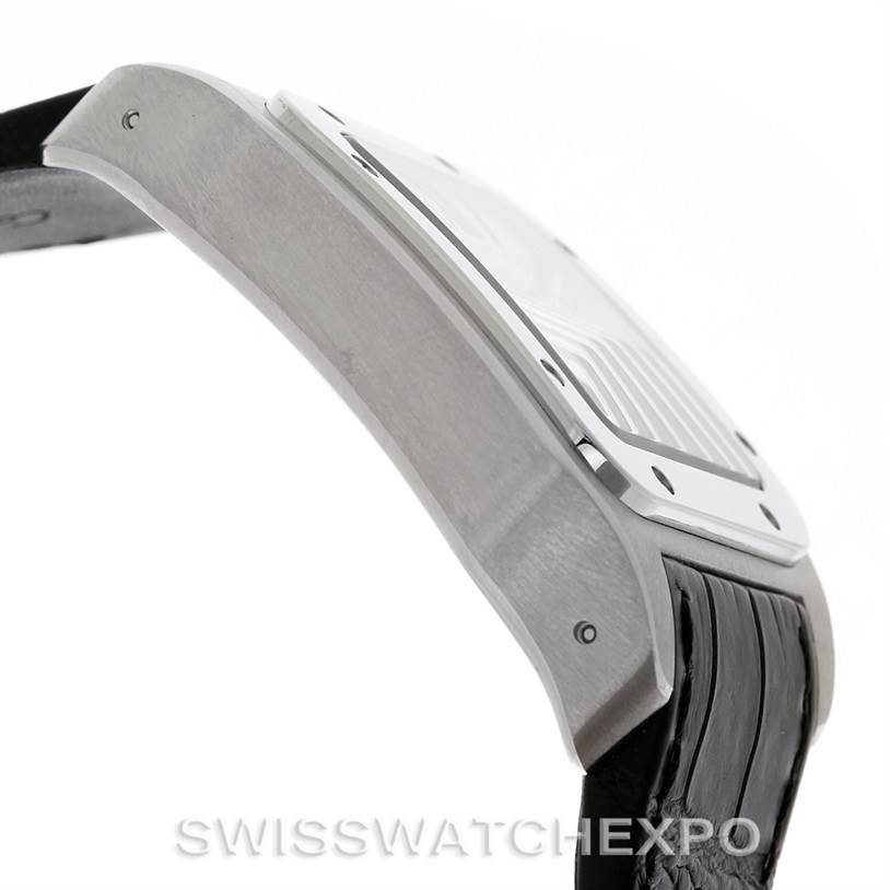 The image shows a side view of a Cartier Santos W20073X8 Men
s Stainless Steel Silver Dial W20073X8 Men
s Stainless Steel Silver Dial watch, highlighting part of the case and the leather strap.
