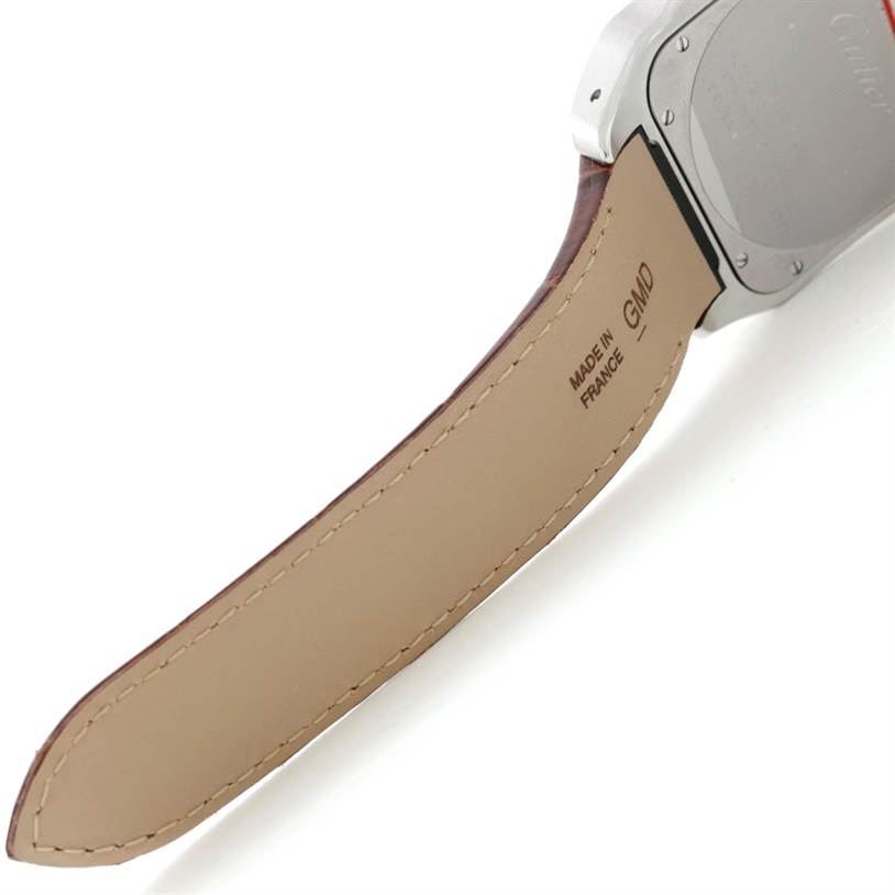 The image shows the back and strap of the Santos model watch by Cartier from a side angle.