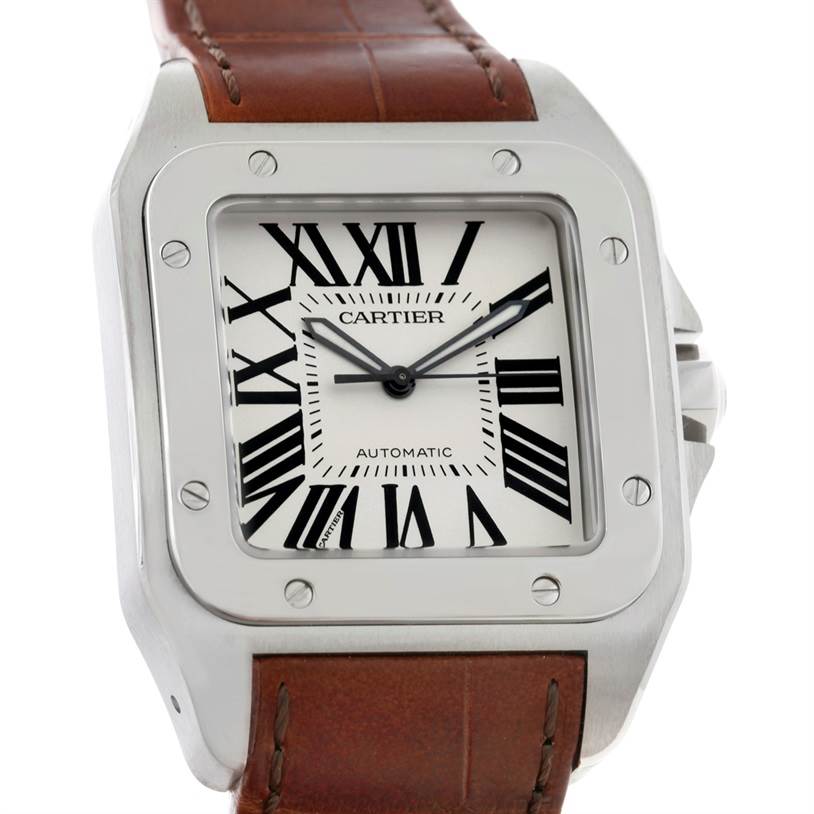 The Cartier Santos W20073X8 Men
s Stainless Steel Silver Dial W20073X8 Men
s Stainless Steel Silver Dial watch is shown from a slightly tilted top-down angle, displaying its face, bezel, crown, and part of the leather strap.