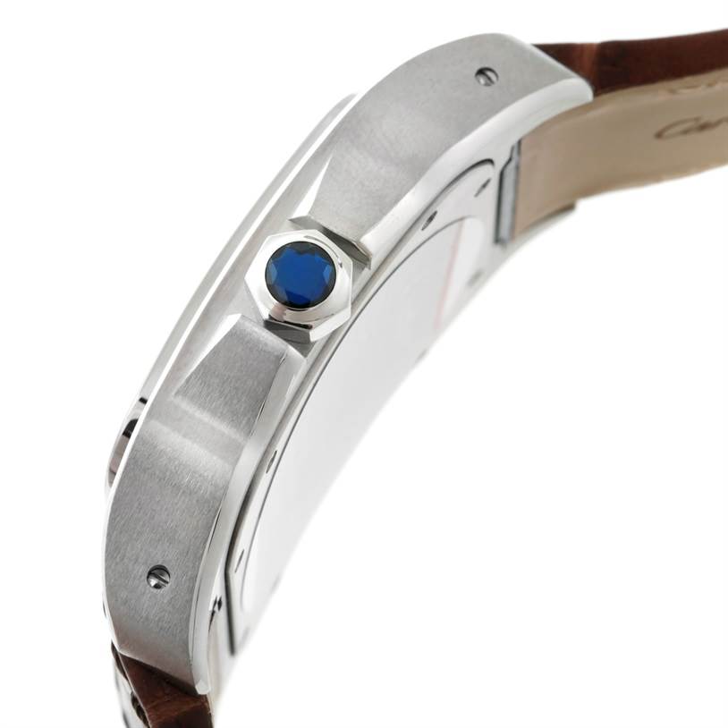 The image shows a side profile of the Cartier Santos W20073X8 Men
s Stainless Steel Silver Dial W20073X8 Men
s Stainless Steel Silver Dial watch, highlighting the crown and part of the case.