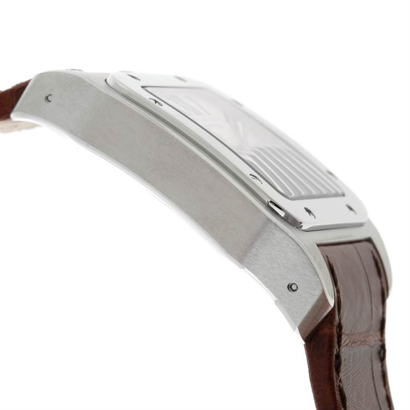 This image shows a side view of the Cartier Santos W20073X8 Men
s Stainless Steel Silver Dial W20073X8 Men
s Stainless Steel Silver Dial watch case and part of its brown leather strap.