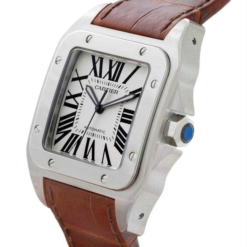 The Cartier Santos W20073X8 Men
s Stainless Steel Silver Dial W20073X8 Men
s Stainless Steel Silver Dial watch is shown at an angled close-up, highlighting the dial, bezel, crown, and leather strap.