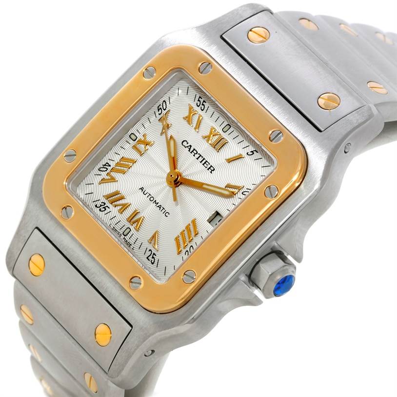 The image shows a close-up, angled view of a Cartier Santos W20058C4 Men's Stainless Steel Silver Dial W20058C4 Men's Stainless Steel Silver Dial watch, highlighting its face, bezel, and part of the bracelet.