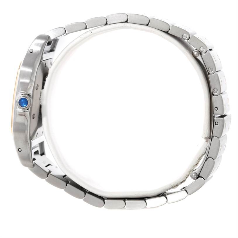 The image shows a side view of the Cartier Santos W20058C4 Men's Stainless Steel Silver Dial W20058C4 Men's Stainless Steel Silver Dial watch, highlighting its metal bracelet and crown with a blue gem.