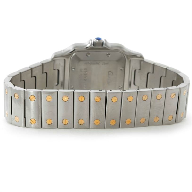 The image shows the backside of a Cartier Santos W20058C4 Men's Stainless Steel Silver Dial W20058C4 Men's Stainless Steel Silver Dial watch and its metal bracelet with screw details.