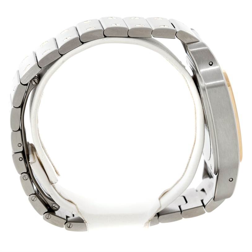 The image shows a Cartier Santos W20099C4 Men's Stainless Steel Silver Dial W20099C4 Men's Stainless Steel Silver Dial watch from the side, highlighting its metal bracelet and casing.