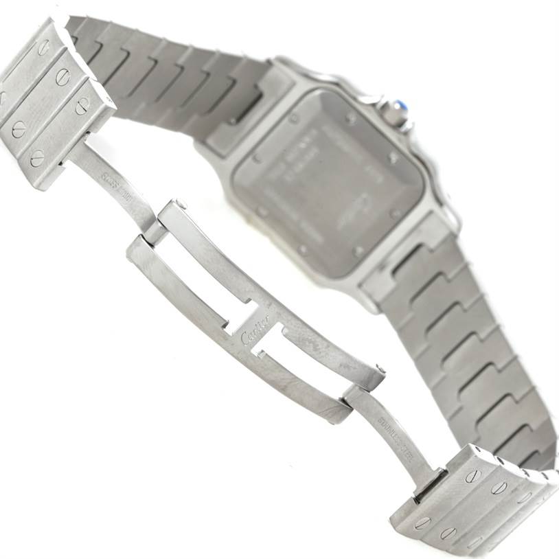 The image shows the back of a Cartier Santos W20055D6 Men
s Stainless Steel Silver Dial W20055D6 Men
s Stainless Steel Silver Dial watch, highlighting its metal bracelet and deployment clasp.