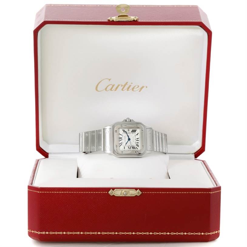 The Cartier Santos W20055D6 Men
s Stainless Steel Silver Dial W20055D6 Men
s Stainless Steel Silver Dial watch is shown front-facing, displayed in an open branded red watch box.
