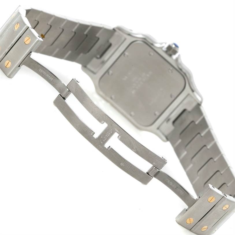 The image shows the back and clasp of a Cartier Santos W20011C4 Men's Stainless Steel Silver Dial W20011C4 Men's Stainless Steel Silver Dial model watch, highlighting its metal bracelet and deployment clasp.