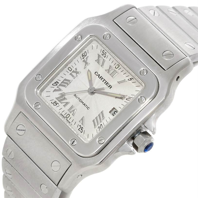 The image shows a close-up view of the Cartier Santos W20055D6 Men's Stainless Steel Silver Dial W20055D6 Men's Stainless Steel Silver Dial watch's dial, bezel, and part of the bracelet.