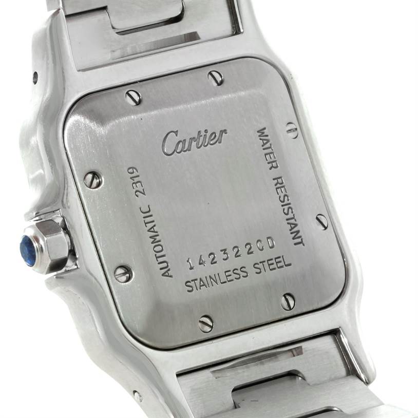 The image shows the back case and part of the bracelet of a Santos model watch by Cartier.