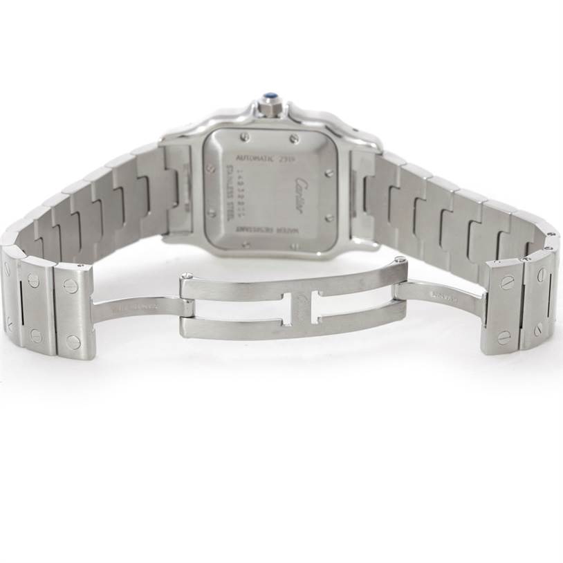 The image shows the case back and bracelet of a Cartier Santos W20055D6 Men's Stainless Steel Silver Dial W20055D6 Men's Stainless Steel Silver Dial watch, highlighting the deployment clasp.