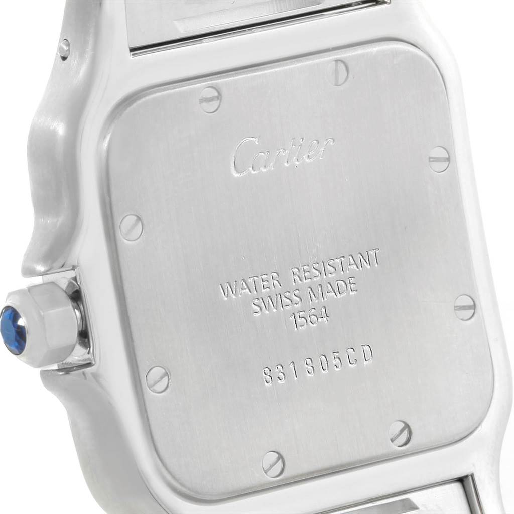 The image shows the back case and crown of a Cartier Santos W20065D6 Men
s Stainless Steel Blue Dial W20065D6 Men
s Stainless Steel Blue Dial watch, engraved with brand details and water resistance information.