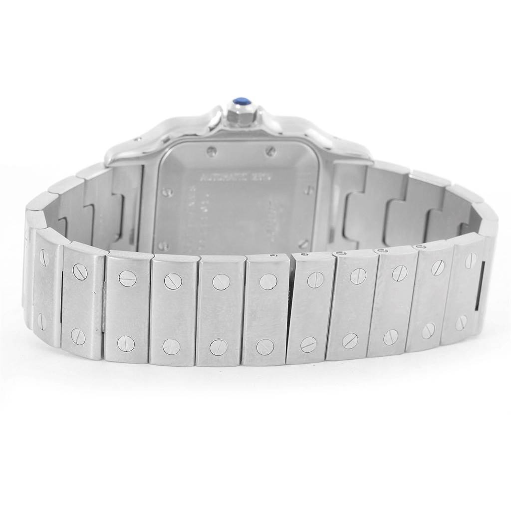 The image shows the back view of a Cartier Santos W20055D6 Men's Stainless Steel Silver Dial W20055D6 Men's Stainless Steel Silver Dial watch, focusing on the stainless steel bracelet and case back.