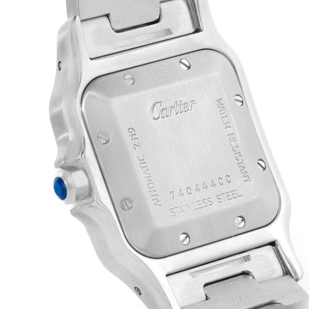 This image shows the back case and part of the bracelet of a Cartier Santos W20055D6 Men's Stainless Steel Silver Dial W20055D6 Men's Stainless Steel Silver Dial watch.