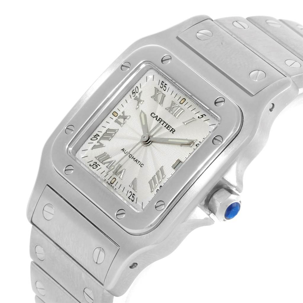The Cartier Santos W20055D6 Men's Stainless Steel Silver Dial W20055D6 Men's Stainless Steel Silver Dial watch is shown from an angled close-up, displaying the face, bezel, and part of the bracelet.