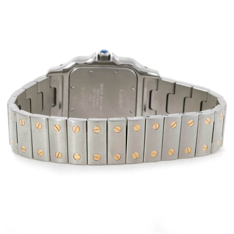 The image shows the back view of the Cartier Santos W20011C4 Stainless Steel Silver Dial W20011C4 Stainless Steel Silver Dial watch, highlighting its metal bracelet and back case.