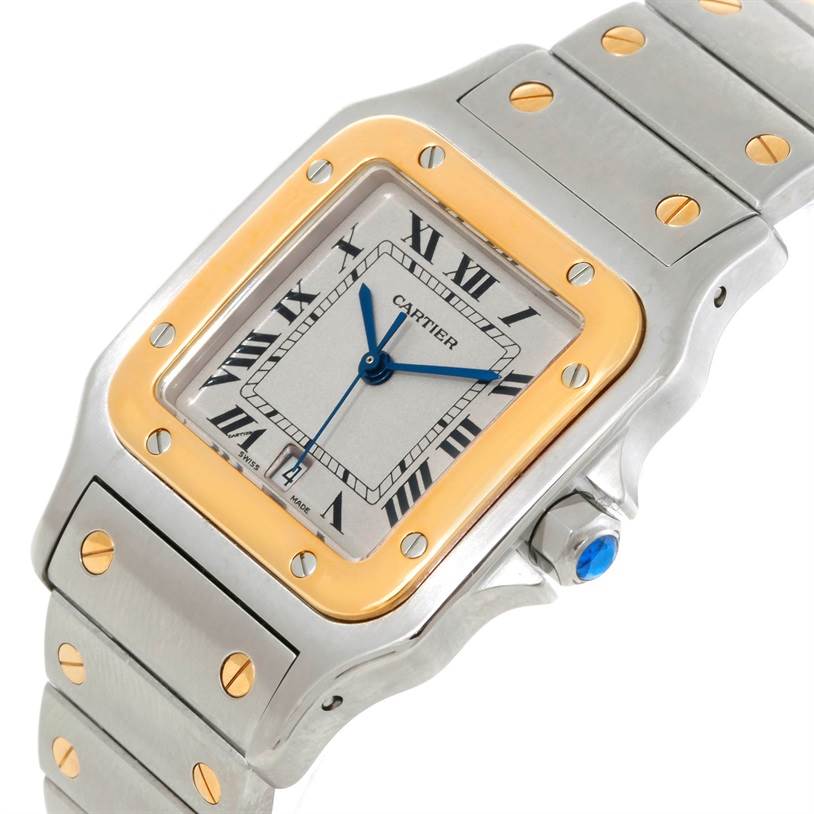 The image shows a close-up of the Cartier Santos W20011C4 Stainless Steel Silver Dial W20011C4 Stainless Steel Silver Dial watch face, bezel, and part of the metal bracelet at an angle.