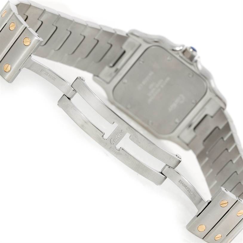 The image shows the back side and bracelet clasp of a Cartier Santos W20011C4 Stainless Steel Silver Dial W20011C4 Stainless Steel Silver Dial watch, highlighting the stainless steel bracelet with gold screws.