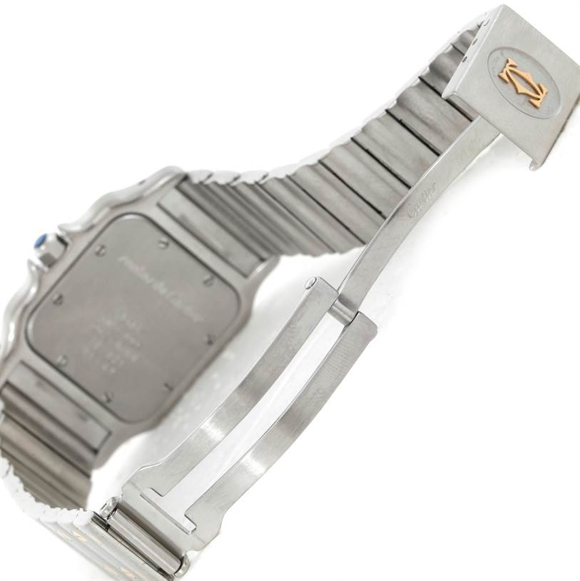 This image shows the underside of the Santos model by Cartier, focusing on the clasp and bracelet.