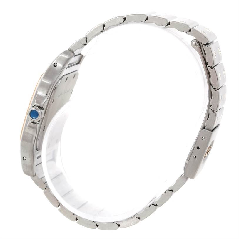 The image shows a side view of the Cartier Santos Stainless Steel Silver Dial Stainless Steel Silver Dial watch, highlighting the bracelet and the crown with a blue gemstone.