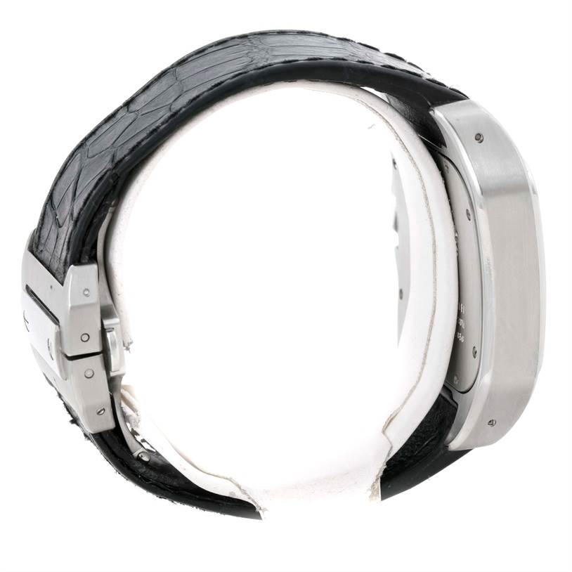 This side-view image of the Santos model by Cartier shows the watch's case, black leather strap, and clasp.