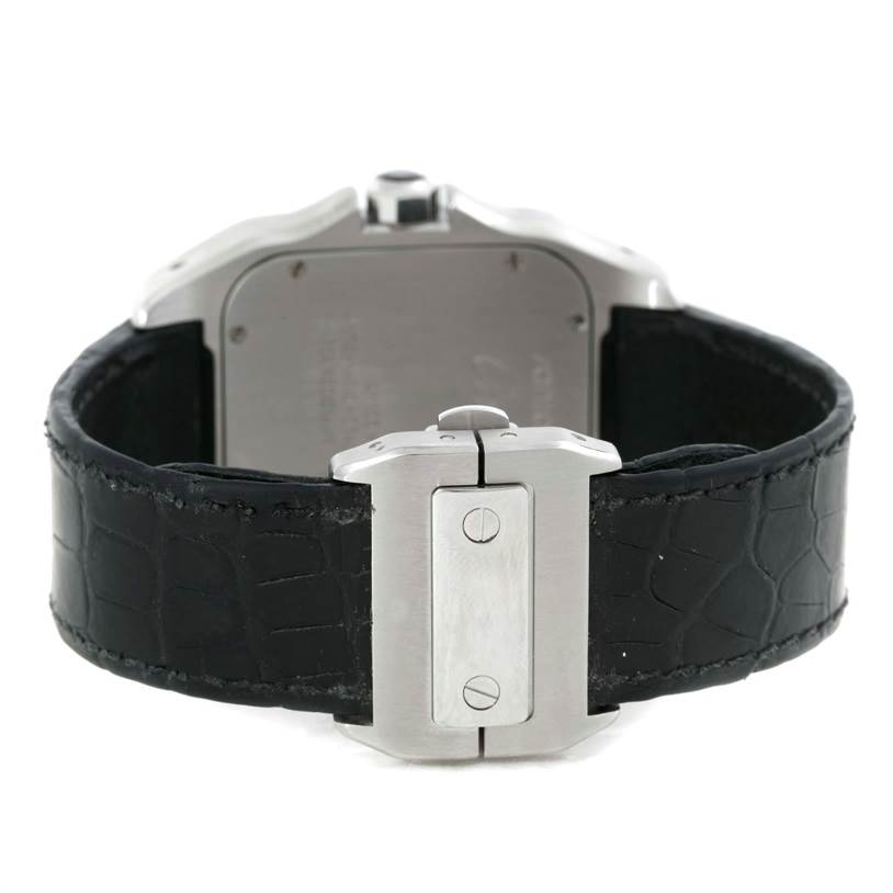 This image shows the back side of a Santos model by Cartier, featuring a black leather strap and clasp mechanism.