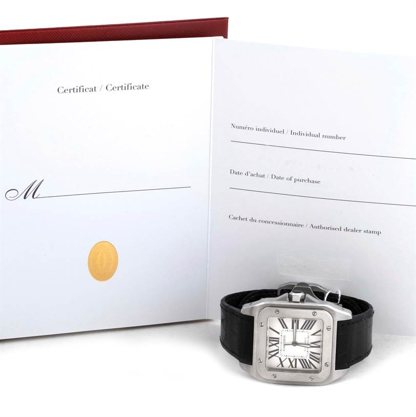 The Santos model by Cartier is shown from a front angle with its certificate booklet in the background.