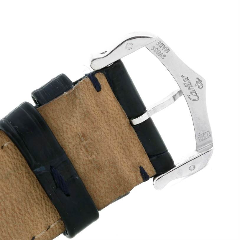 The image shows a close-up of the buckle and leather strap of a Tank Louis model by Cartier.
