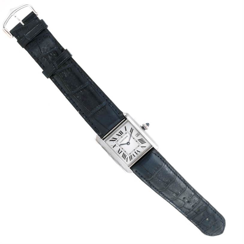 The image shows a Cartier Tank Louis W1540956 Men
s White Gold White Dial W1540956 Men
s White Gold White Dial model watch from a top-down angle, displaying its face and black strap.