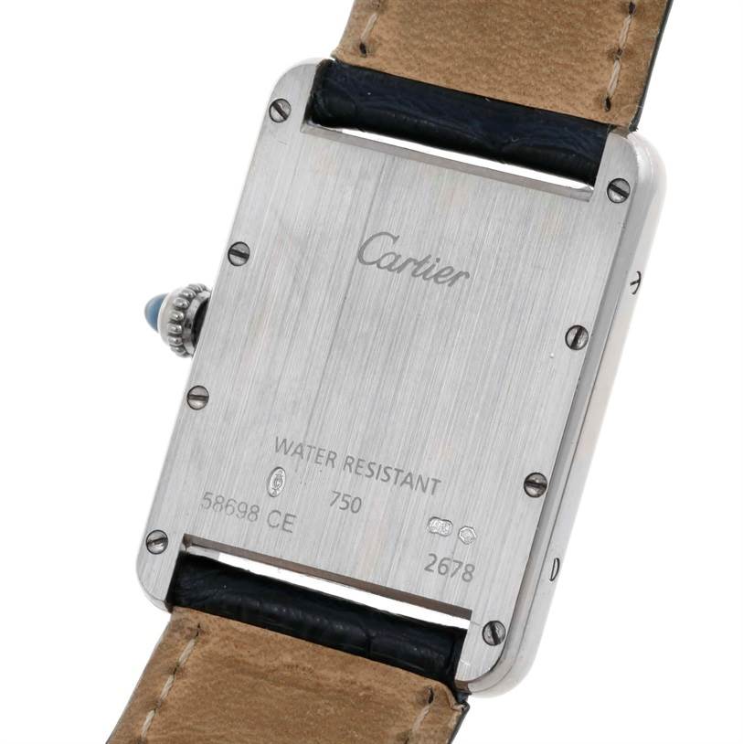 The image shows the back of the Cartier Tank Louis W1540956 Men
s White Gold White Dial W1540956 Men
s White Gold White Dial watch, focusing on its case back and strap attachment.