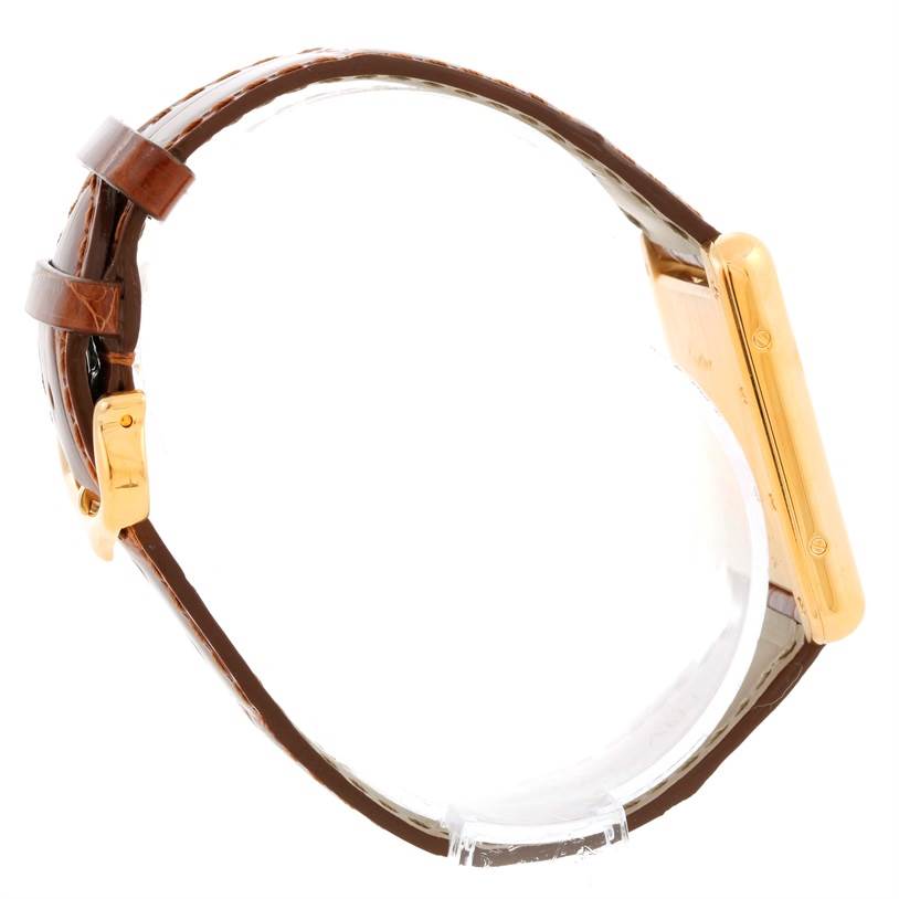 The image shows a Tank Louis model by Cartier from the side, displaying the watch band and case.