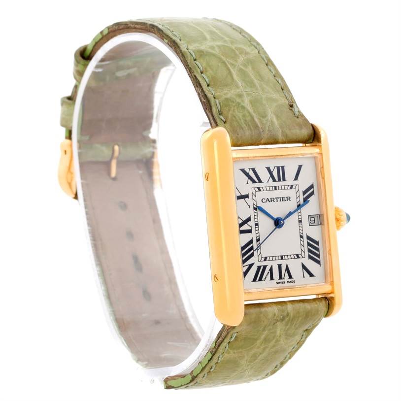 This image shows the front and side of a Cartier Tank Louis W1529756 Men's Yellow Gold Silver Dial W1529756 Men's Yellow Gold Silver Dial watch with a green leather strap, displaying its case, dial, and date window.