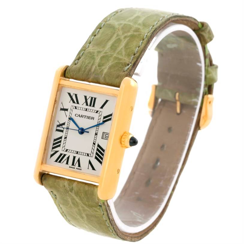The Cartier Tank Louis W1529756 Men's Yellow Gold Silver Dial W1529756 Men's Yellow Gold Silver Dial watch is shown angled from the front/side, displaying the face, Roman numerals, and a green leather strap.