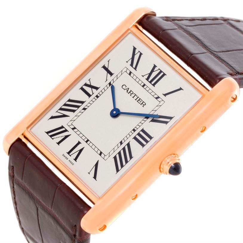 This image shows a close-up view of the Cartier Tank Louis W1560017 Men's Rose Gold Silver Dial W1560017 Men's Rose Gold Silver Dial watch, focusing on the dial, case, and part of the strap at an angle.