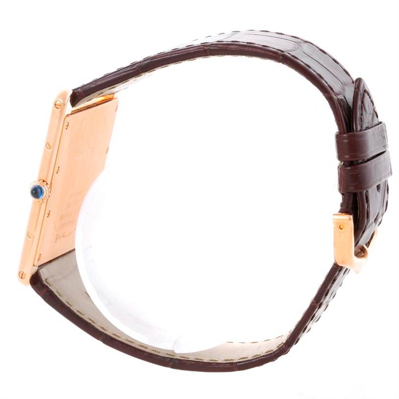 The image shows a side view of a Cartier Tank Louis W1560017 Men's Rose Gold Silver Dial W1560017 Men's Rose Gold Silver Dial watch highlighting its strap and crown.