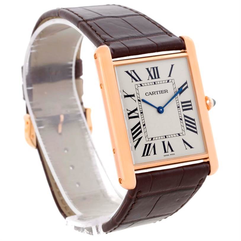 The image shows a Cartier Tank Louis W1560017 Men's Rose Gold Silver Dial W1560017 Men's Rose Gold Silver Dial watch at an angle highlighting its face, Roman numeral dial, leather strap, and crown.