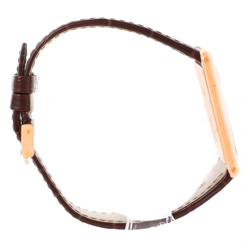 The image shows a side view of a Cartier Tank Louis W1560017 Men's Rose Gold Silver Dial W1560017 Men's Rose Gold Silver Dial watch, highlighting the strap and case.